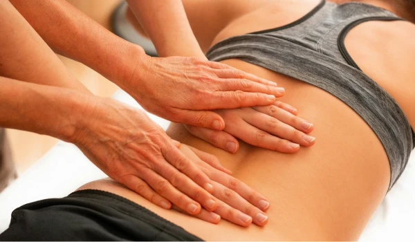 Massage therapist teaching massage
