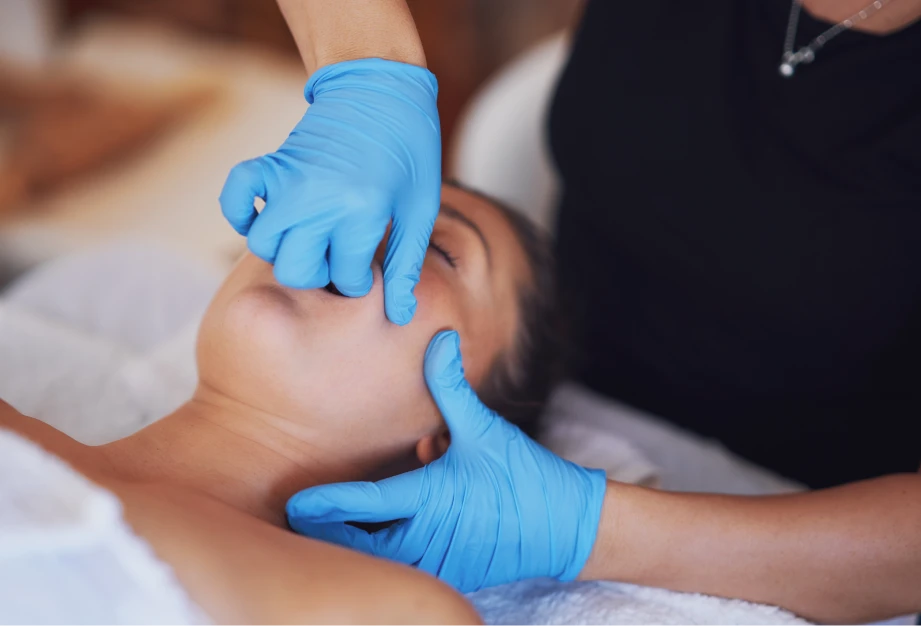 woman getting a Intra-Oral (TMJD) Massage