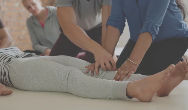 Massage therapist teaching Lower body
