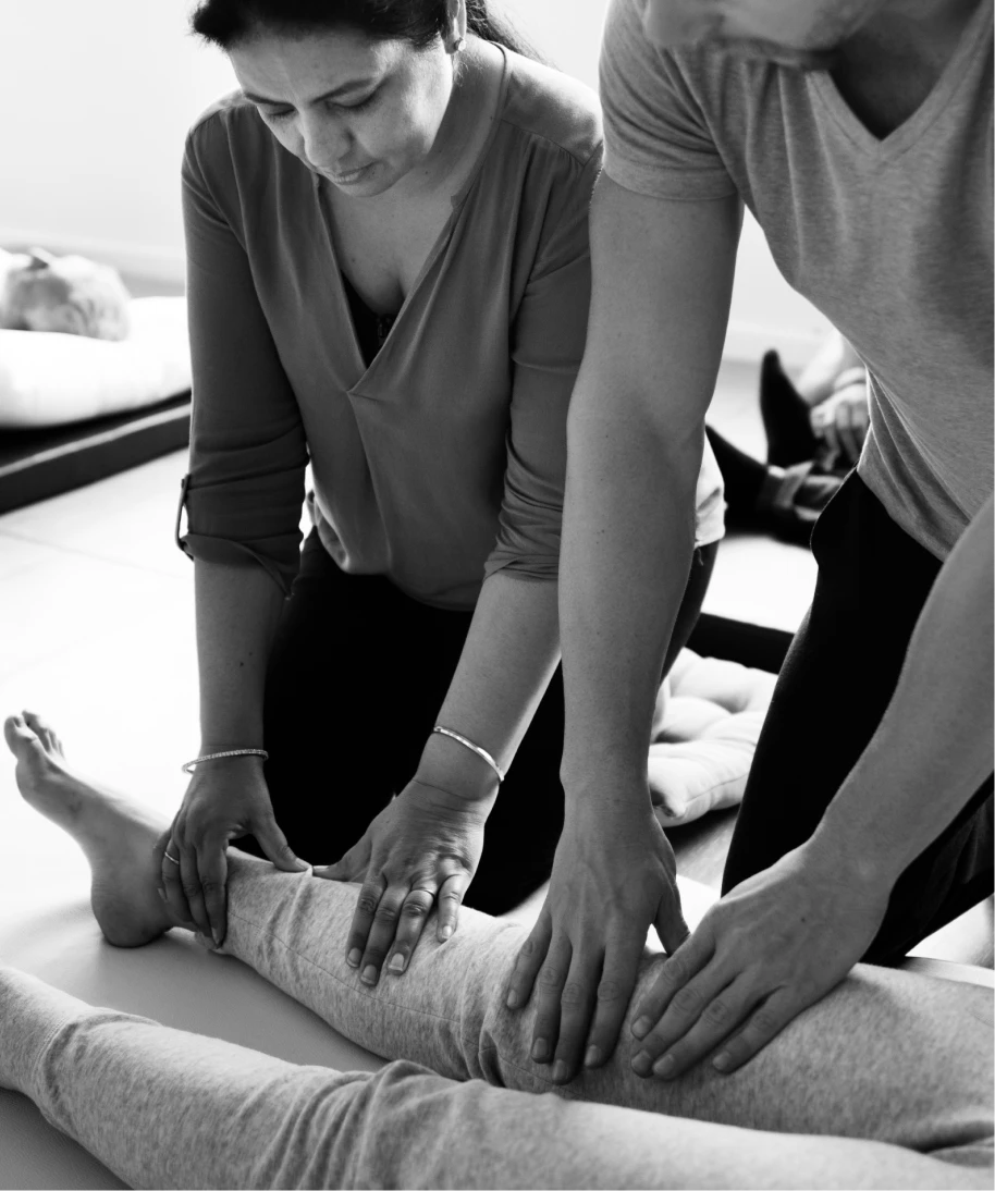 Person receiving guidance on massage therapy